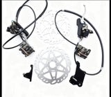 Sur-Ron Ultra OEM hydraulic brake kit layout with front and rear calipers, levers and lines displayed — rotors and brackets shown for reference only